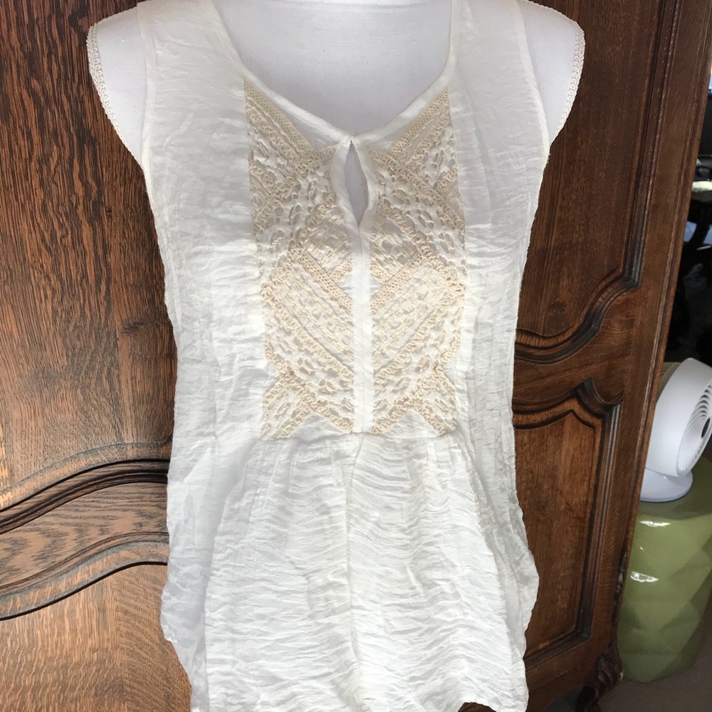 Cream embroidered short sleeve blouse.